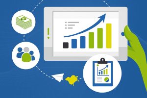 Tablet showing growth chart with icons for money, people, and reports